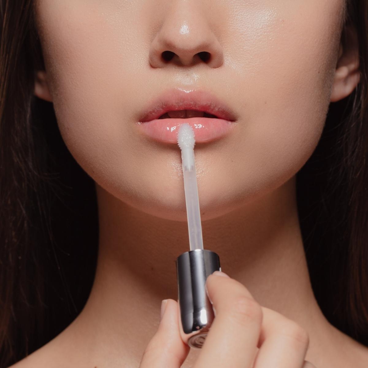 Close-up of a person applying korean lip balm