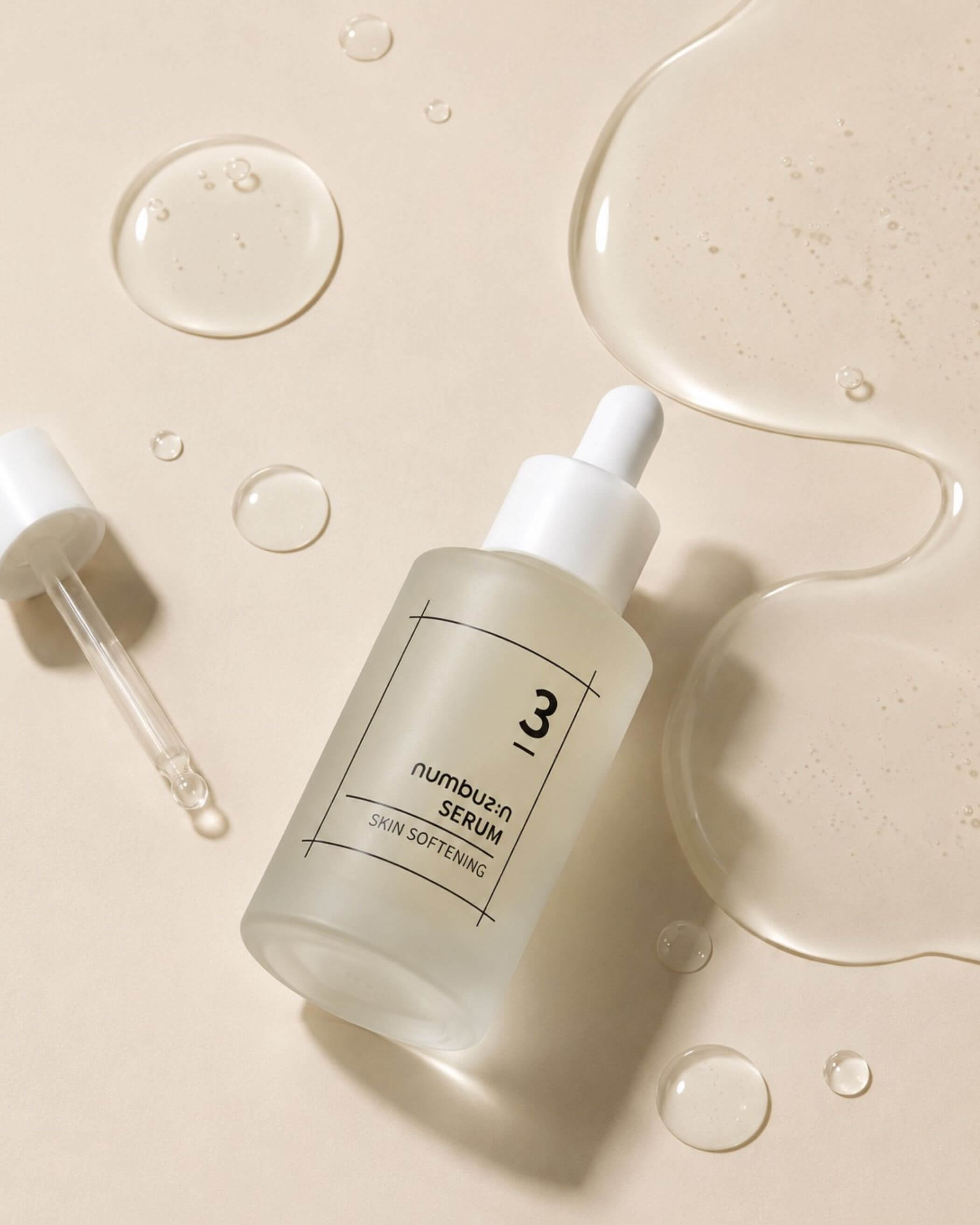 Numbuzin No.3 Skin Softening Serum bottle with dropper on a beige background