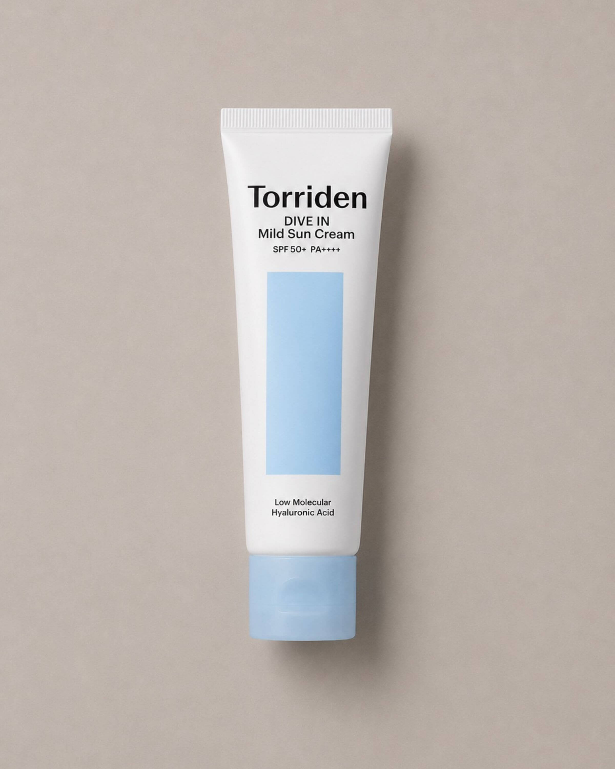 Tube of Torriden Dive In Mild Sun Cream on a beige background