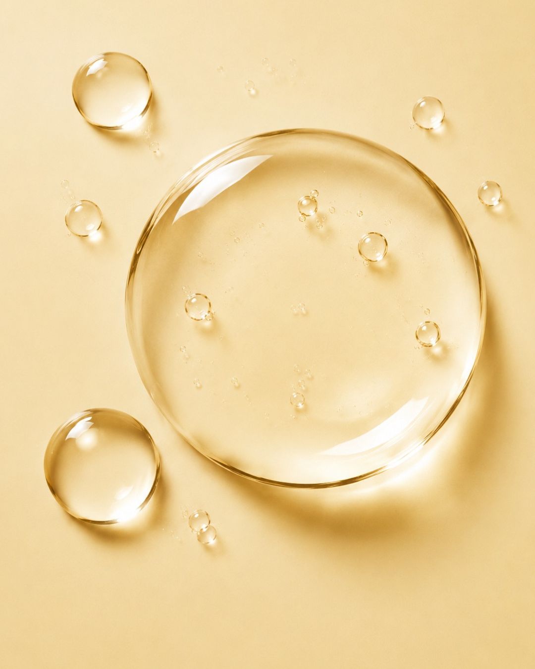 Close-up of vitamin c droplets on a yellow background