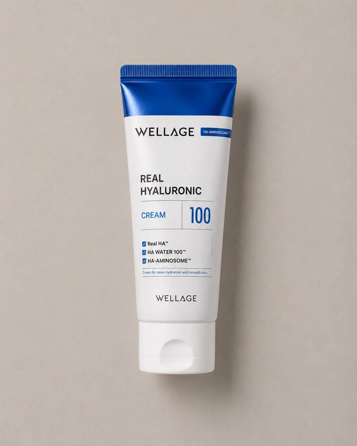 Wellage Real Hyaluronic Cream tube on a beige background