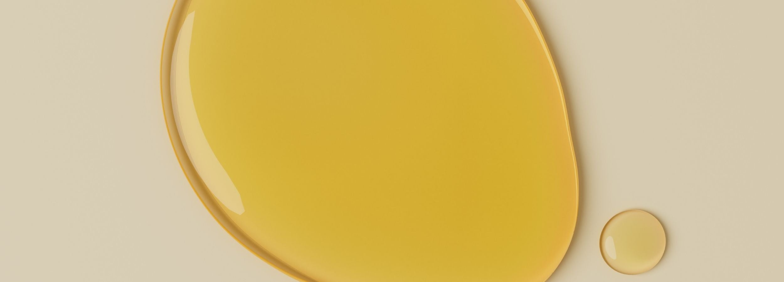 Yellow vitamin c liquid on a beige background